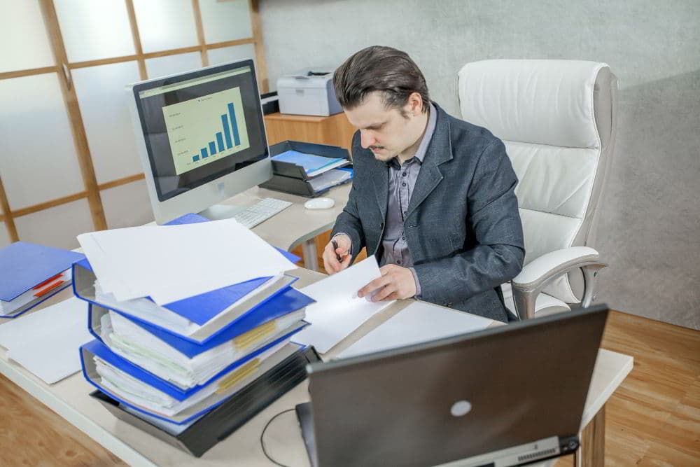 Support specialist working at an office desk