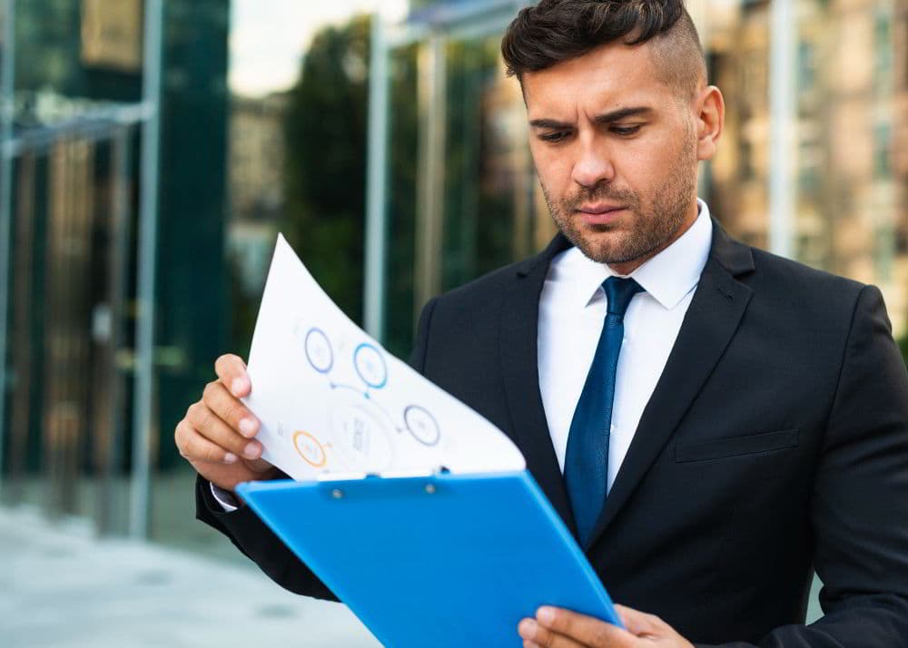 Retail associate reviewing fiscal documentation