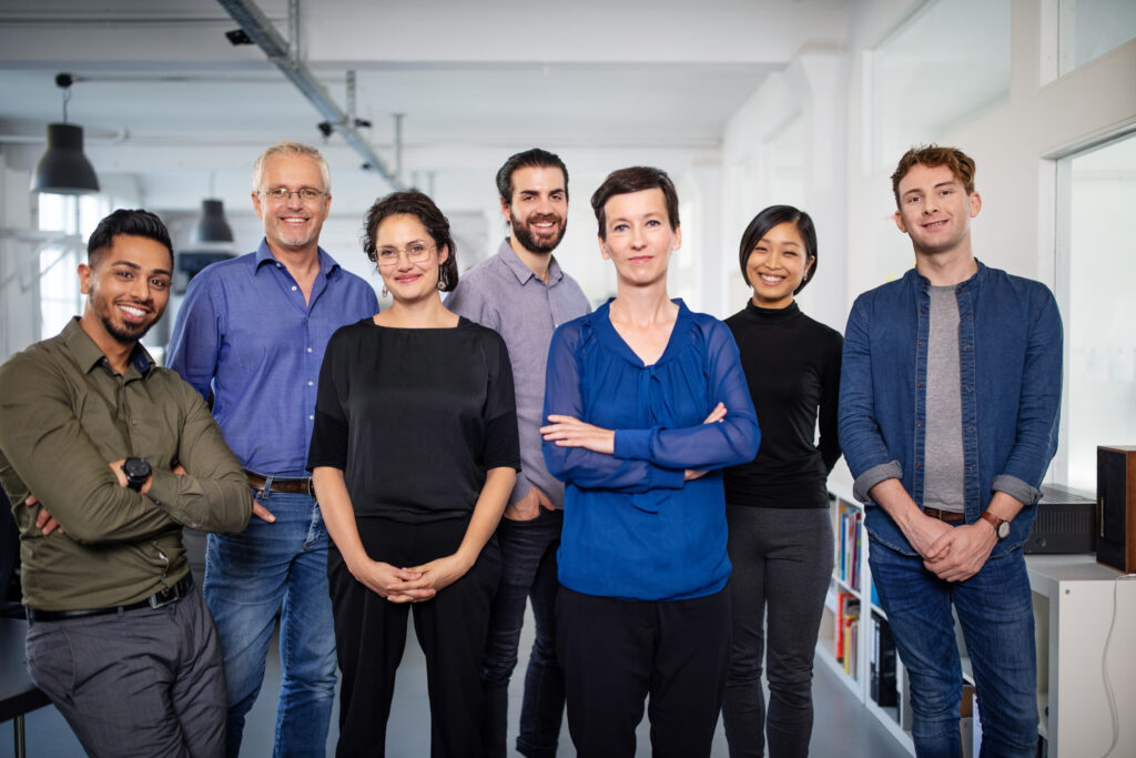 Portrait of a diverse business team looking at camera. Multi-ethnic group of business people standing in office.