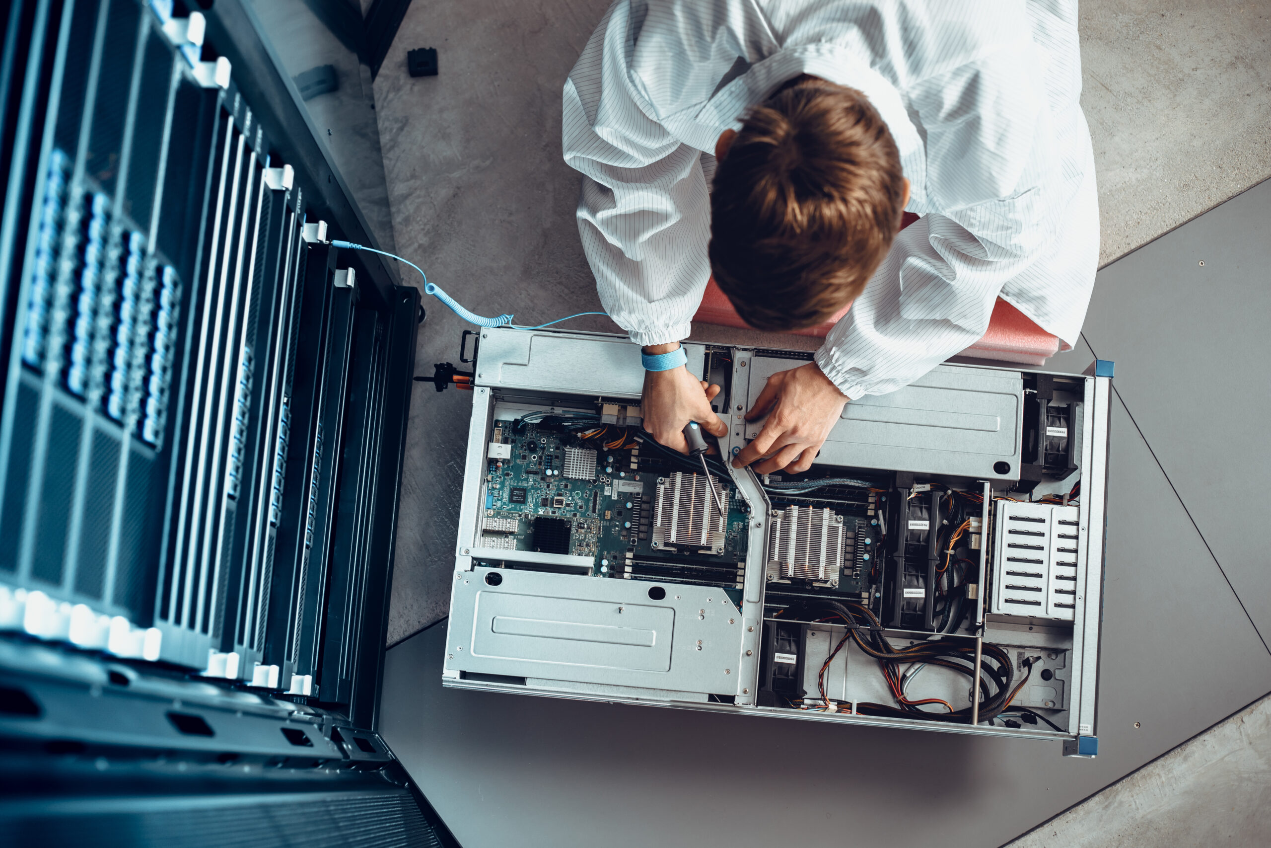 IT Engineer Servicing Part of a Supercomputer.